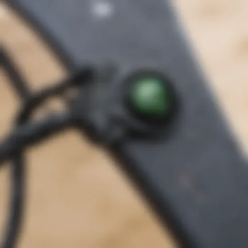 Close-up view of a sleek leash plug integrated into a kiteboard