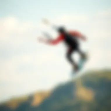 A kiteboarder soaring through the air, the colors of their wetsuit contrasting with the sky