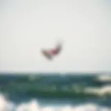 Kiteboarder soaring through the air over the ocean