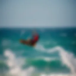 Kiteboarder soaring above the waves of El Pescadero