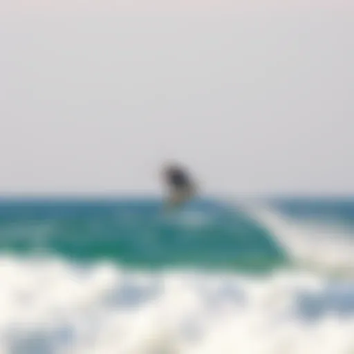 Kiteboarder soaring high above the waves