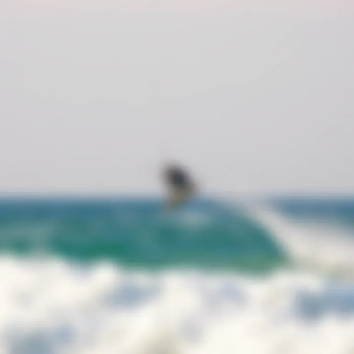 Kiteboarder soaring high above the waves