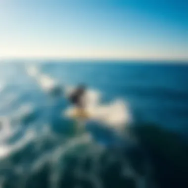 An aerial shot of surfers utilizing powered surf foils in a stunning ocean landscape.