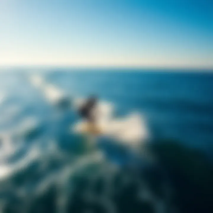 An aerial shot of surfers utilizing powered surf foils in a stunning ocean landscape.