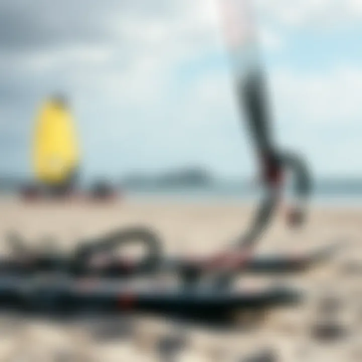 Close-up of kiteboarding gear ready for launch on a sandy beach