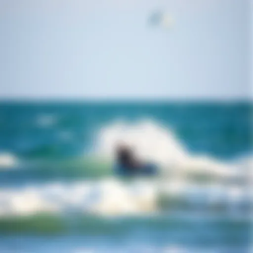 Kiteboarder gliding over the waves at Floridana Beach