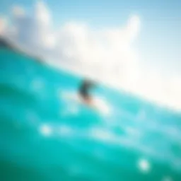 Kite surfer gliding over turquoise waters