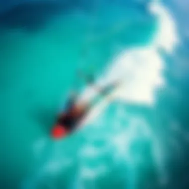 Aerial Perspective of Kite Surfing An aerial view of a kite surfer gliding across the waves
