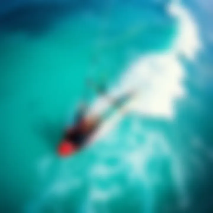 Aerial Perspective of Kite Surfing An aerial view of a kite surfer gliding across the waves