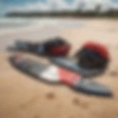 Essential kiteboarding gear displayed on a sandy shore