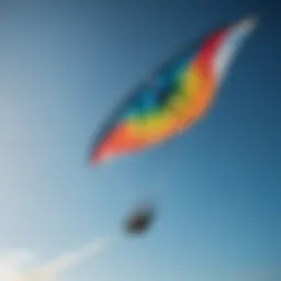 A vibrant kitesurf kite soaring in a clear blue sky