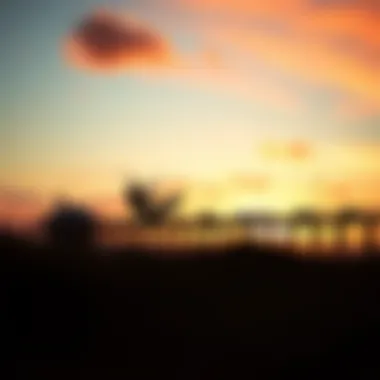 Kiteboarding at Sunset A kiteboarder catching air against a vibrant sunset at Lake Worth Pier