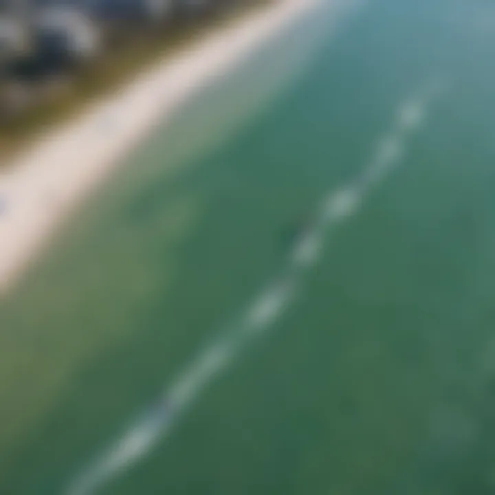 An aerial view of kiteboarders enjoying a sunny day at the beach