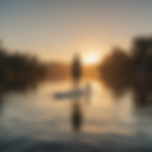 A serene paddle boarder gliding across calm waters at sunrise