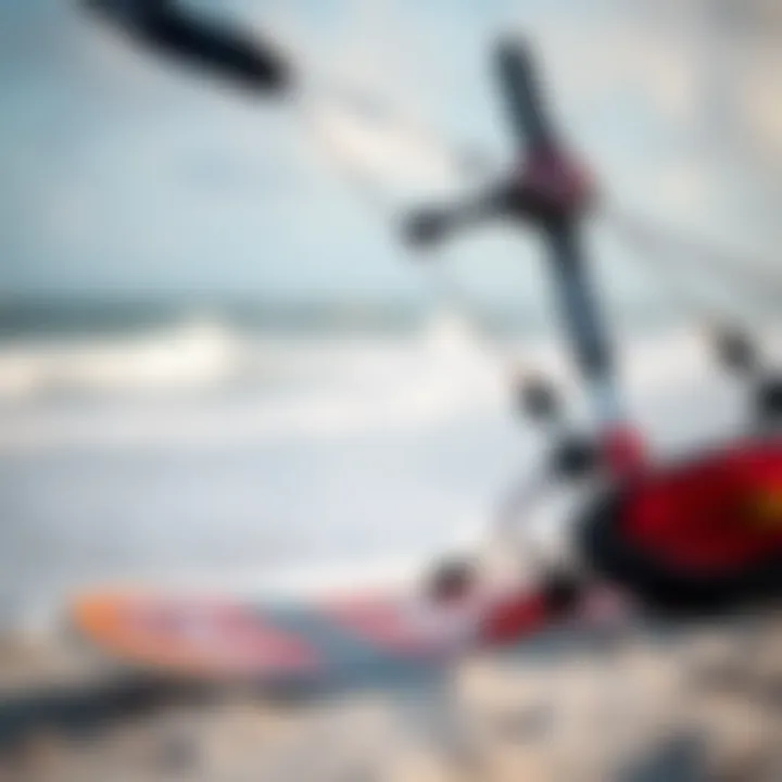 Close-up of kiteboarding gear on the beach with ocean waves