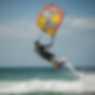 Kiteboarder executing a back roll in the air