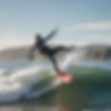 A kiteboarder catching a wave, demonstrating skill and excitement in the waters of Bodega Bay.