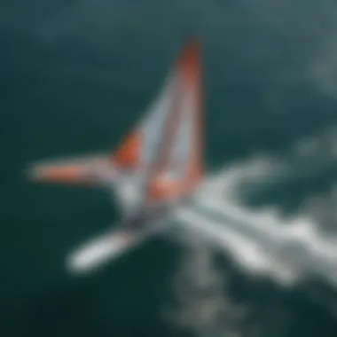 An aerial shot capturing the thrilling moment of one wing foiling on the water, highlighting the speed and agility.