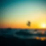 Kitesurfer soaring above the waves at sunset