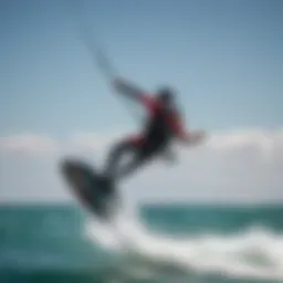 A kiteboarder soaring above the water with a wind hydrofoil