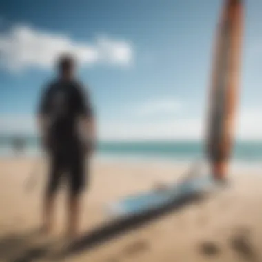 A kiteboarder examining a wing foil while discussing features with a fellow enthusiast.