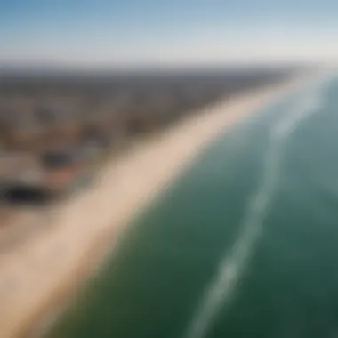 A panoramic view of Venice Beach Pier with kiteboarders in the distance