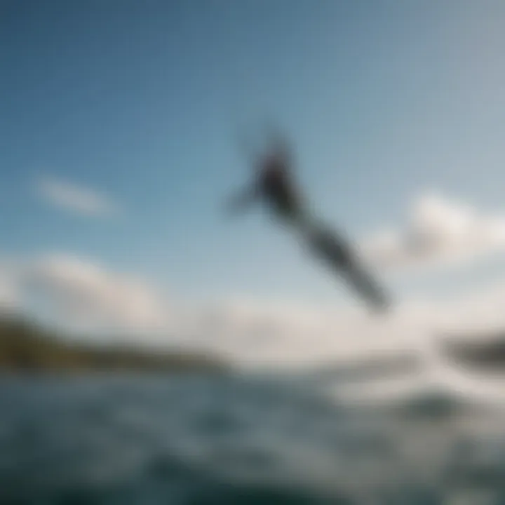 A kiteboarder soaring above the water with a fanatic foil setup