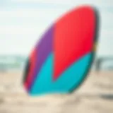 A vibrant kite board on the beach with a clear sky