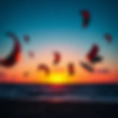 A stunning sunset over the ocean with kite surfers silhouetted against the sky