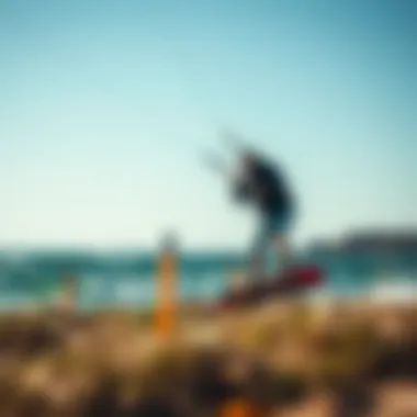 A kiteboarder using ground stakes to secure their kite in a windy environment, demonstrating practical application.