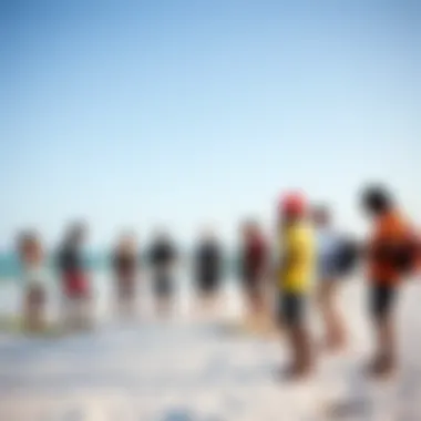 A diverse group of kiteboarders sharing tips at the beach