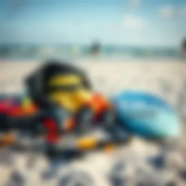 Essential kiteboarding gear laid out on the beach