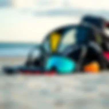 Kiteboarding gear displayed on a sandy beach