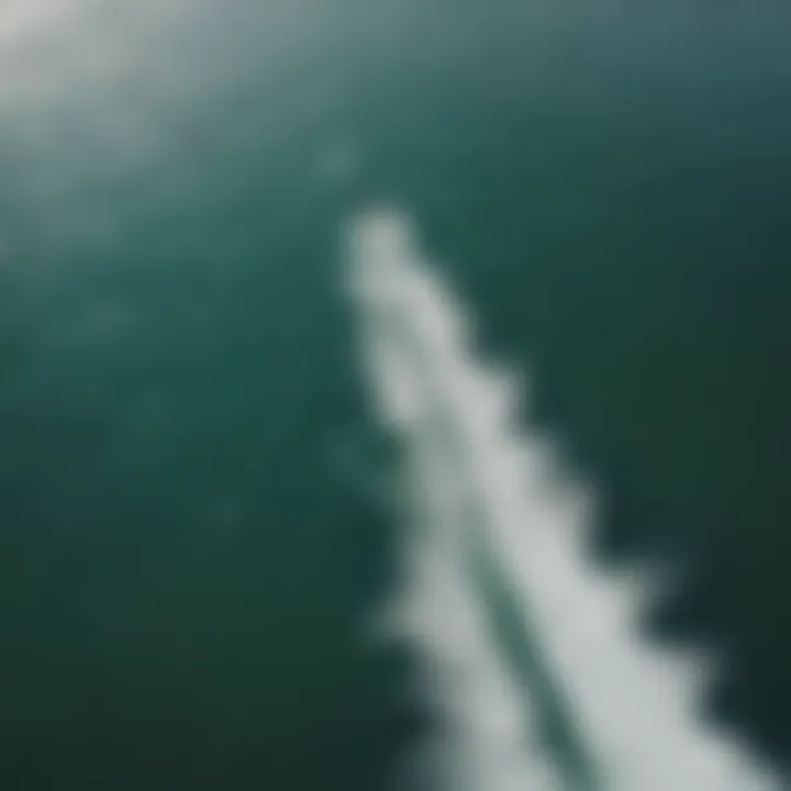 An aerial view of a kiteboarding practice session on the water.