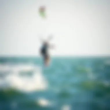 Kiteboarder gliding effortlessly above the water using a mini hydrofoil.