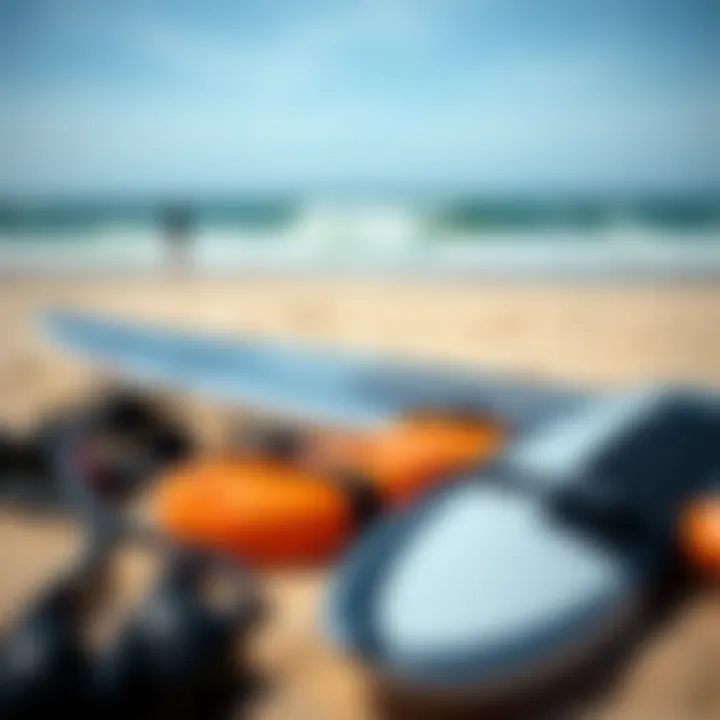 Close-up of kitesurfing equipment laid out on the beach