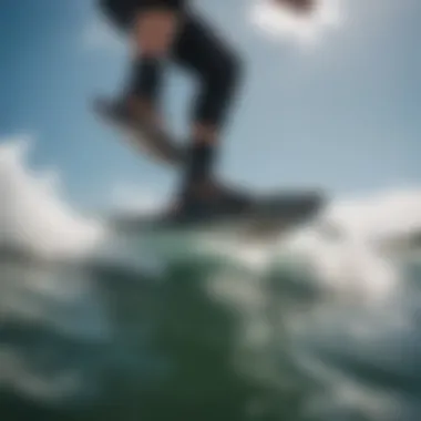 A kiteboarder demonstrating the fit of Liquid Force boots while riding the waves.