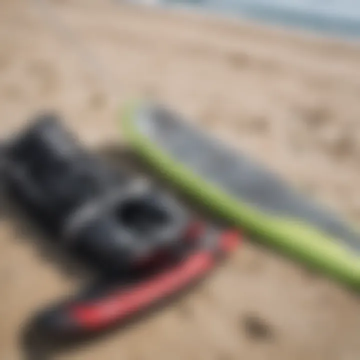 A close-up of kite surfing equipment laid out on the beach