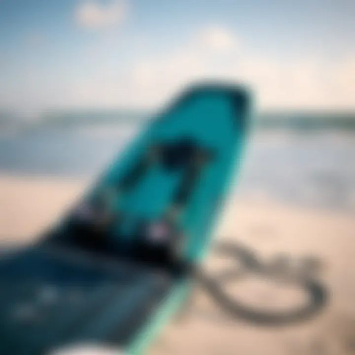 Close-up of a high-quality kiteboard and harness on the beach.