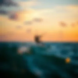 A kiteboarder expertly navigating the waves during sunset.