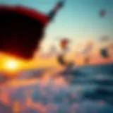 A stunning view capturing a kitesurfer in action against a vibrant sunset.