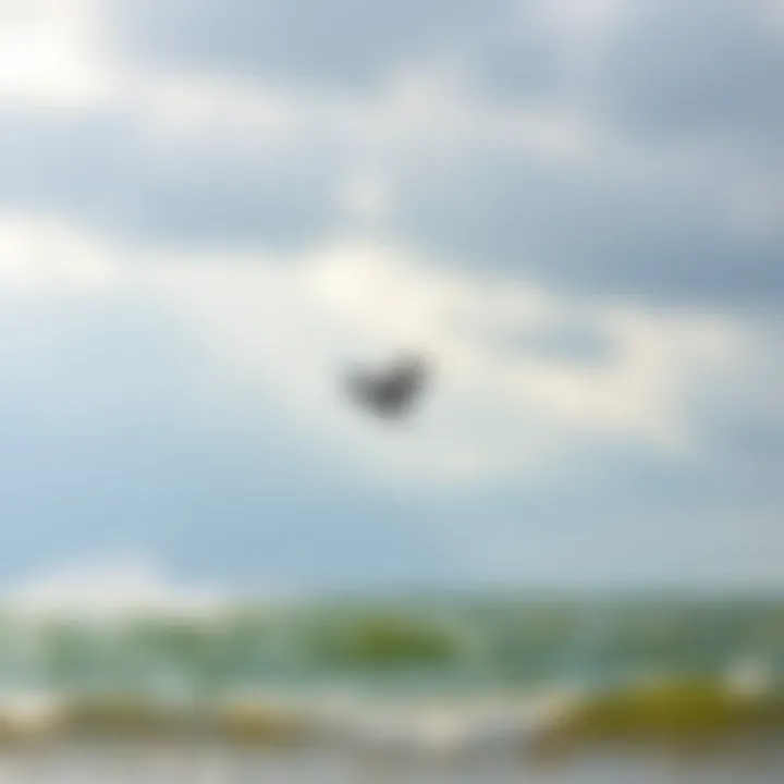 Kiteboarder launching into the wind against a cloudy sky