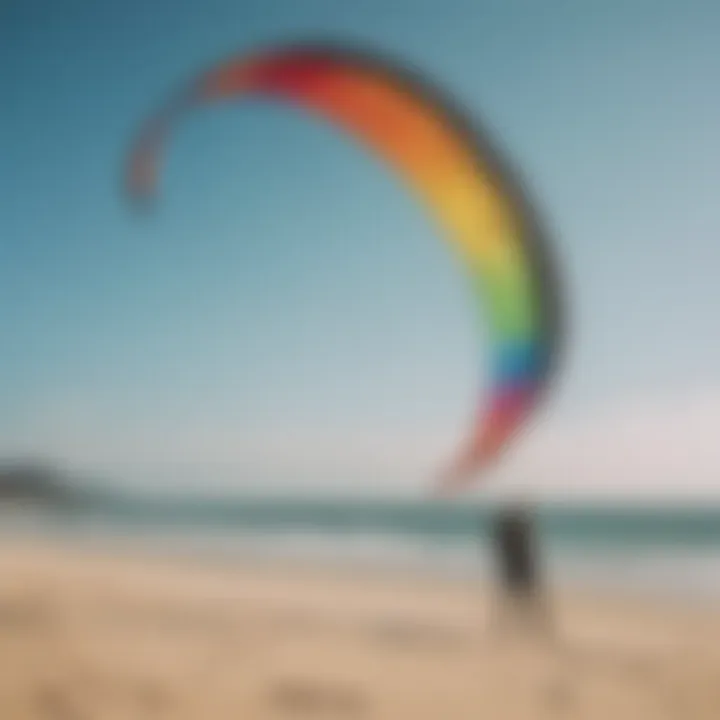 Kiteboarder inspecting a large kite on the beach