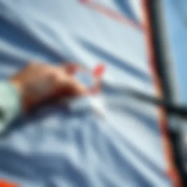 Patch Application for Sail Durability Close-up of a patch being applied to a damaged sail