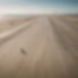 A panoramic view of St. Peter Ording's coastline showcasing the vast sandy beaches and kiteboarders in action.