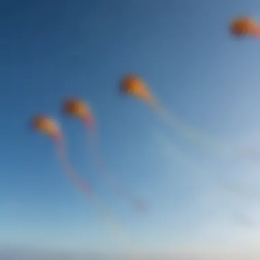 Close-up of colorful kites soaring high against a clear blue sky, capturing the essence of kiteboarding.