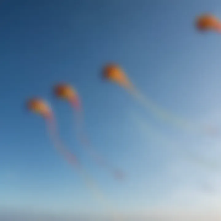 Close-up of colorful kites soaring high against a clear blue sky, capturing the essence of kiteboarding.