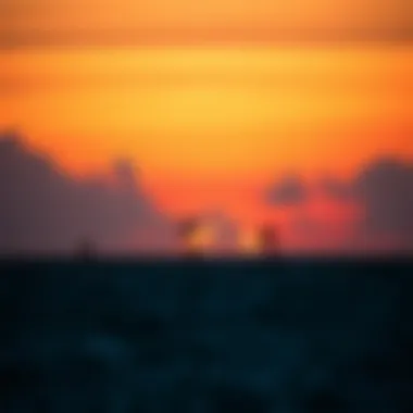 Silhouettes of Kiteboarders at Sunset A stunning sunset backdrop with kiteboarders silhouetted against the colorful sky.