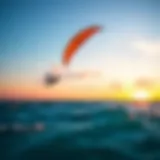 A vibrant kite soaring above a turquoise ocean during a sunset