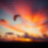 A stunning Flexifoil kite soaring against a vibrant sunset